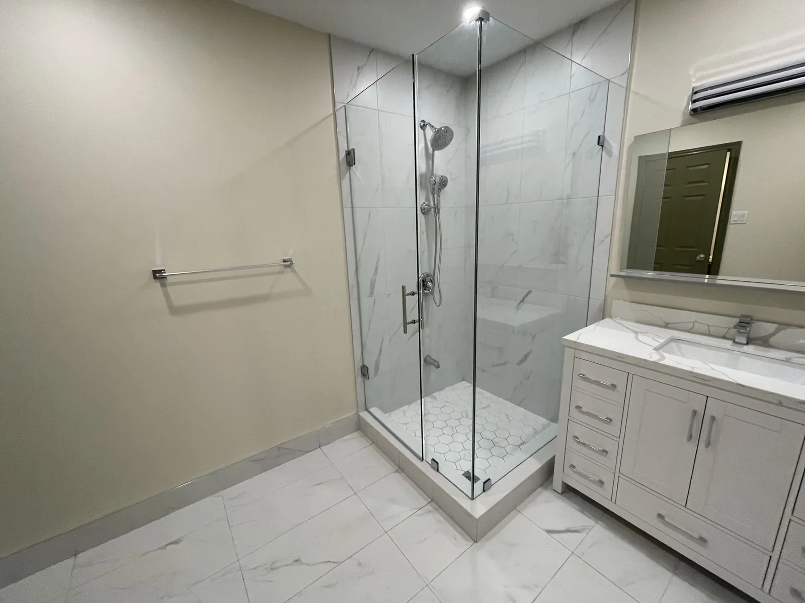 Bathroom renovation with glass shower and vanity