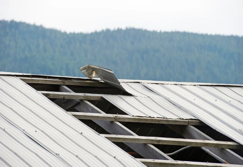 Storm-damaged metal roof