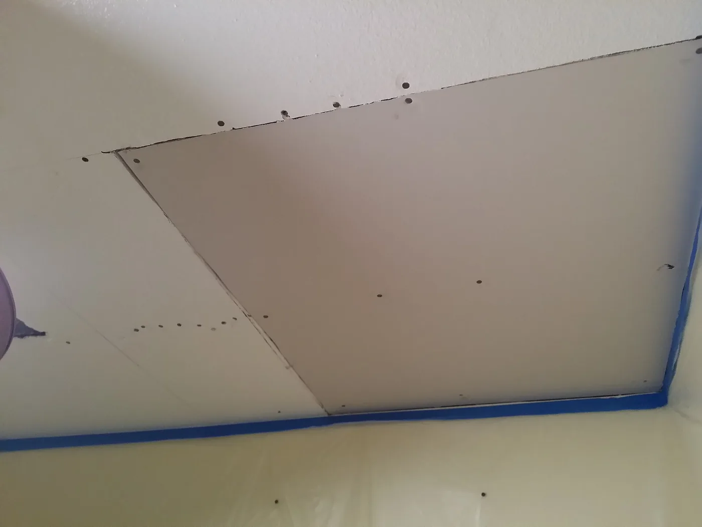 Ceiling drywall patched after a leak
