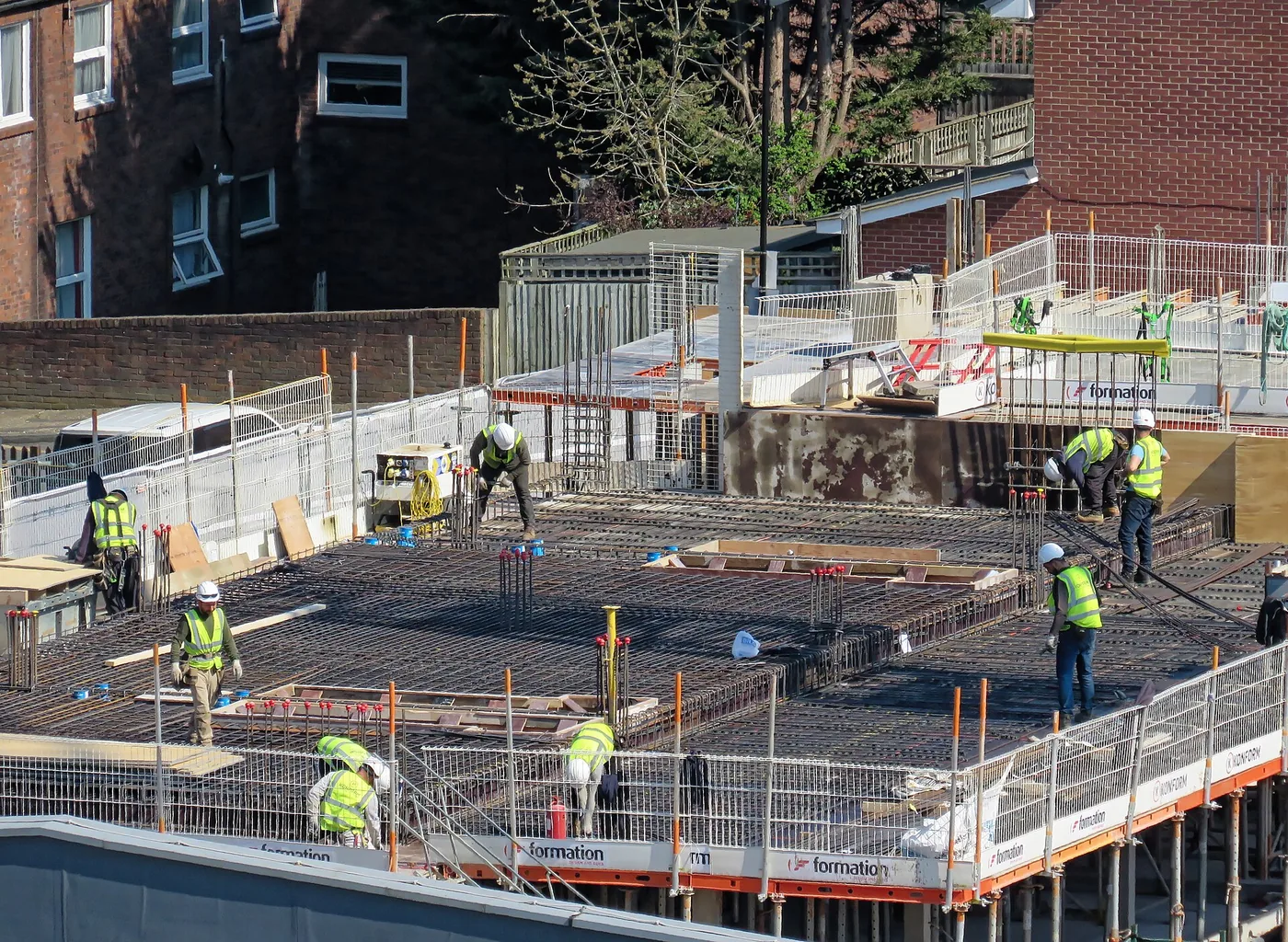 Construction crew working on a new floor slab