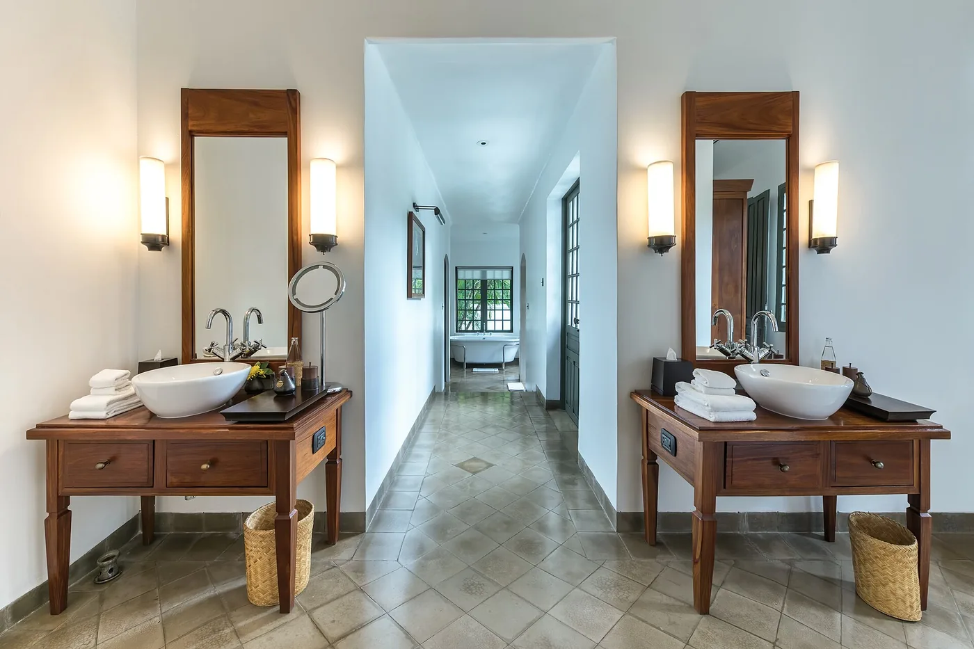 Bathroom with double vanity and wood finishes