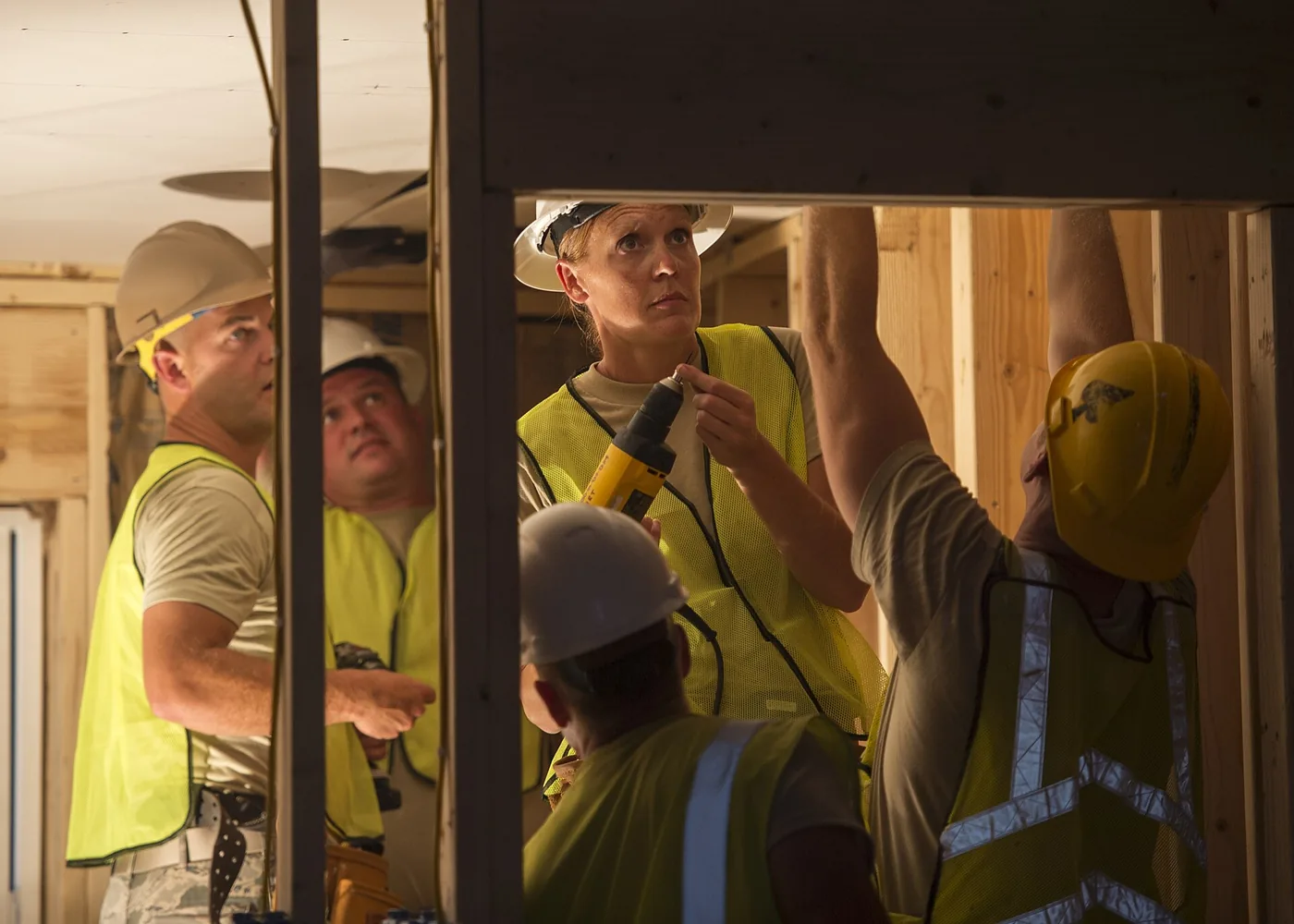 Contractors working together on interior framing