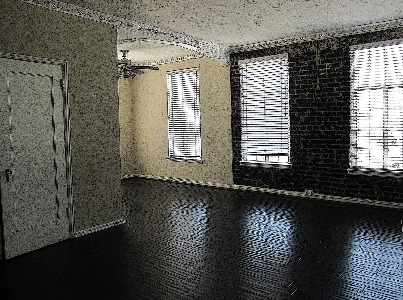 Renovated room with new flooring and freshly painted walls