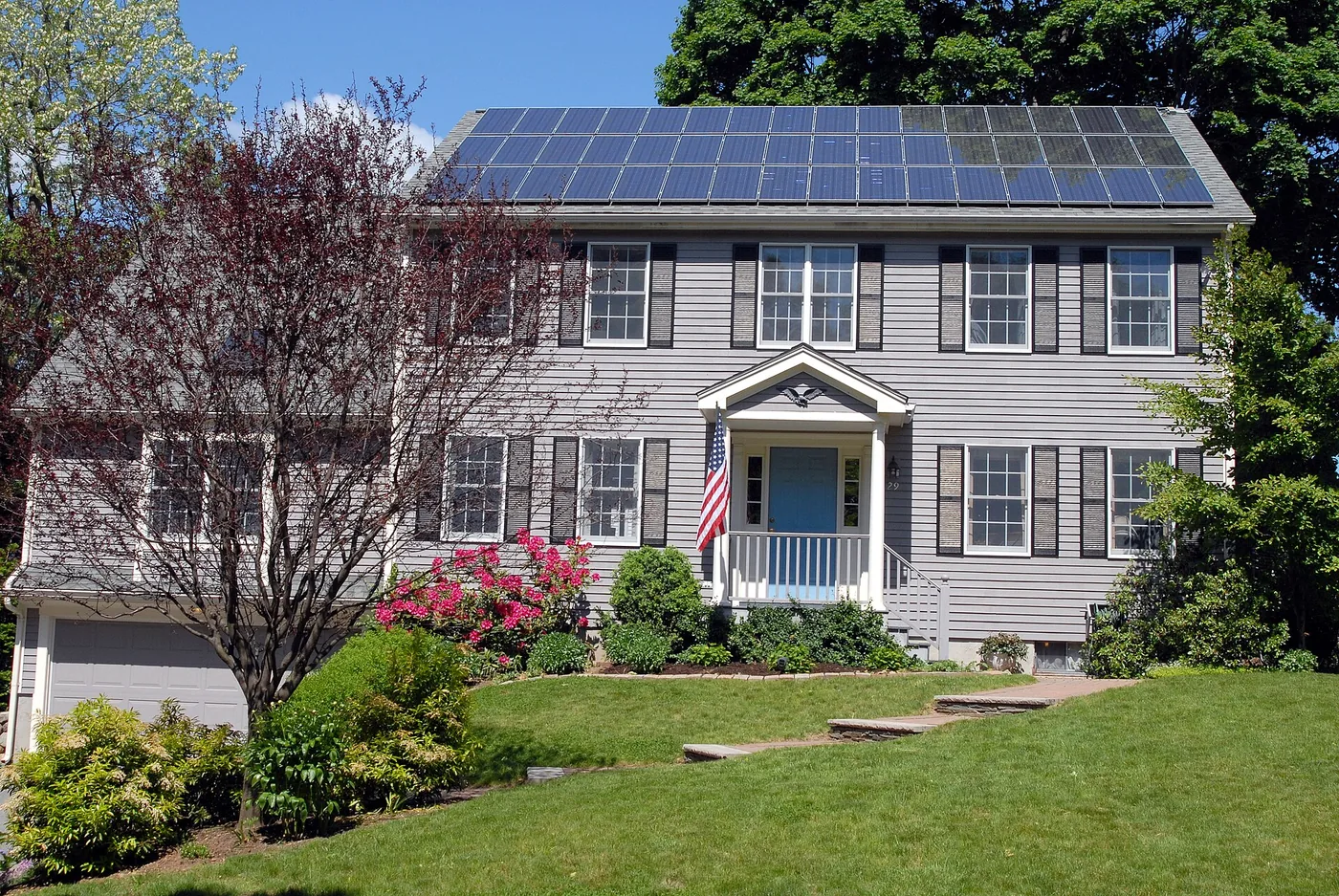 Two-storey house with solar panels on the roof